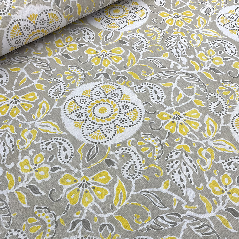 Modelo 576 Tela loneta resinada con diseño floral tipo encaje en tonos amarillo, blanco y gris