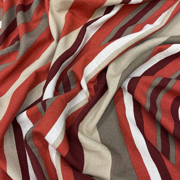 Tela lino con estampado de rayas onduladas en tonos terracota y beige