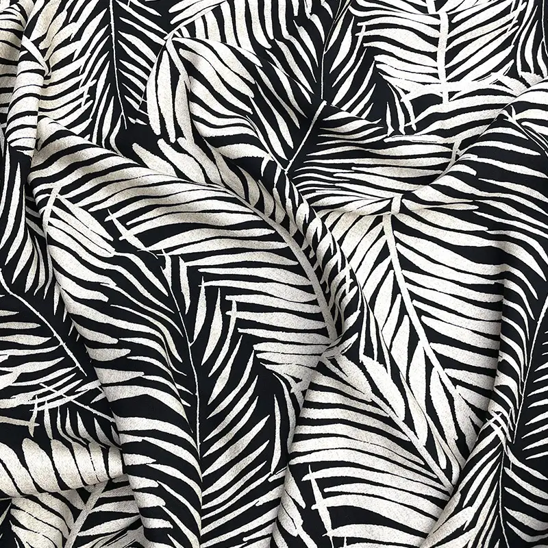 tela-poplin-rayon-hojas-blancas-fondo-negro-800x800 Tela poplin rayón con hojas blancas sobre fondo negro, diseño tropical monocromático