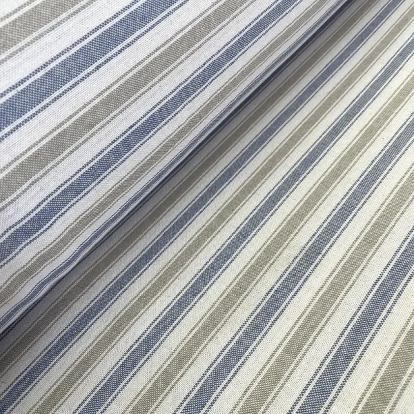 Tela loneta con rayas azules, grises y blancas sobre fondo natural, ideal para decoración de interiores