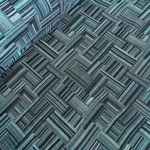 Tela gobelino azul con patrón de rayas frías entrelazadas, ideal para tapicería, cortinas y decoración moderna.