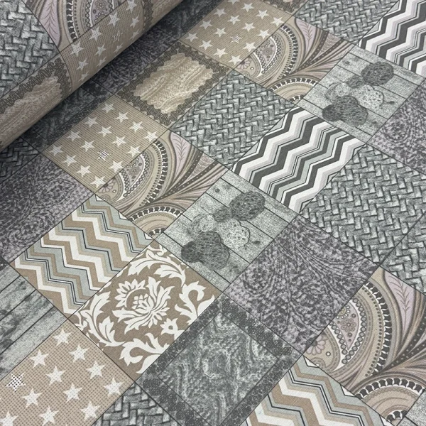 Estampado digital tipo mosaico con patrones geométricos y damascos en tonos gris y café sobre loneta mexicana de 2.80 metros de ancho.