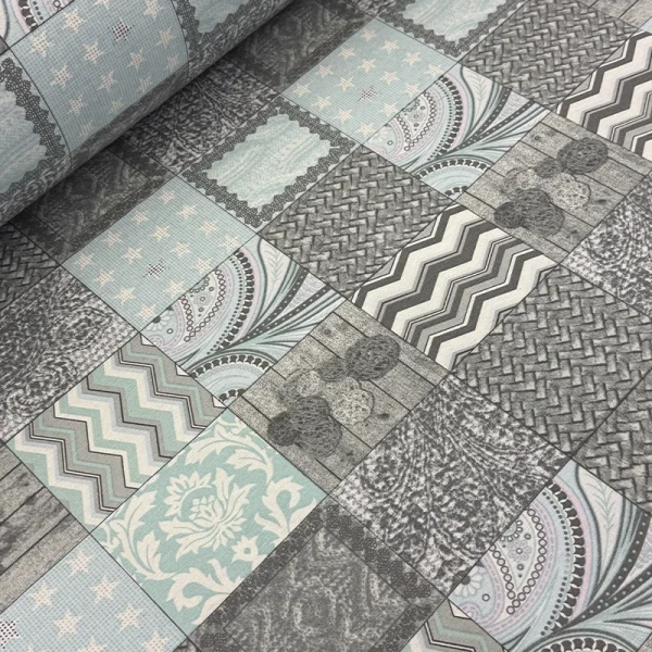 Estampado digital tipo mosaico con patrones geométricos en tonos gris y celeste sobre loneta mexicana de 2.80 metros de ancho