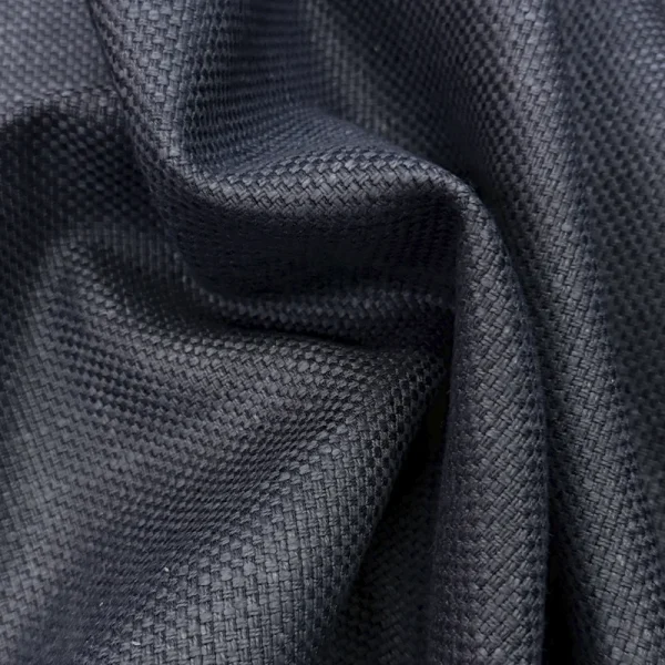 Primer plano de la textura de tejido plano de la Tela Siena en color azul marino, mostrando su trama resistente y acabado elegante.