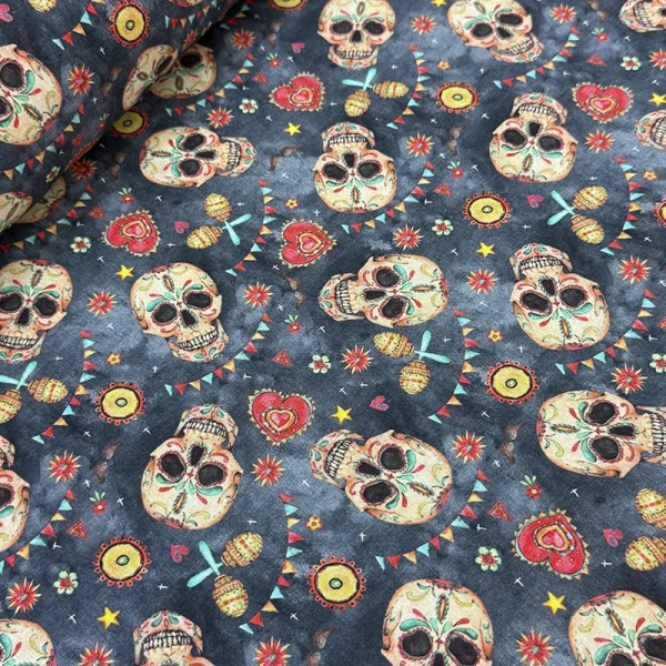 Tela Petite Calaveras Catrinas en Azul con estampado digital de calaveritas mexicanas folclóricas para costura y confección de ropa.