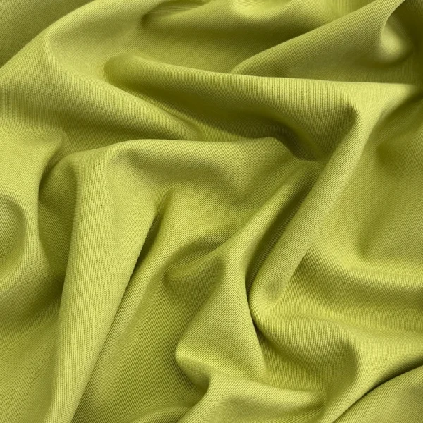 Loneta Trim Verde Lima de diseño liso y tonalidad verde vibrante, ideal para cortinas, tapicería, fundas, manteles y decoración del hogar.